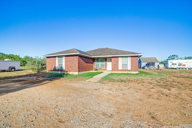 single story home with brick siding