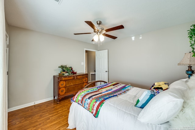 bedroom with hardwood / wood-style floors and ceiling fan