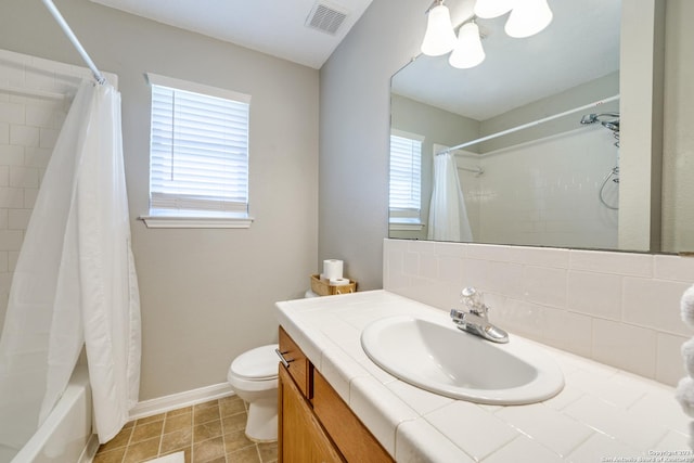 bathroom with shower / bath combo, visible vents, baseboards, toilet, and vanity