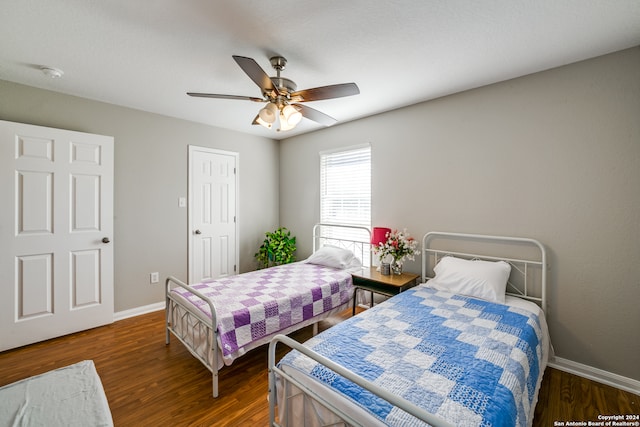 bedroom featuring dark wood-type flooring and ceiling fan