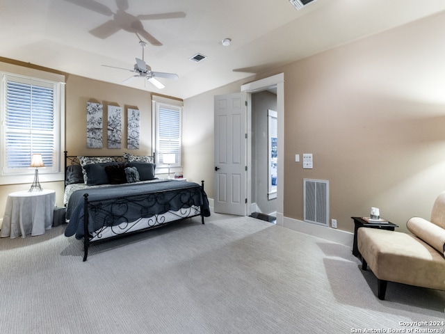 bedroom featuring ceiling fan and light colored carpet