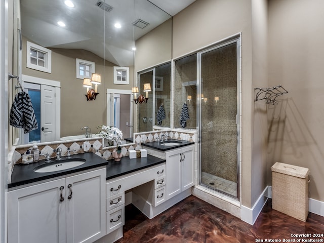 bathroom with vanity and an enclosed shower