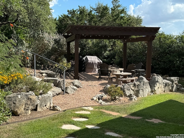 view of yard with a fire pit and a patio