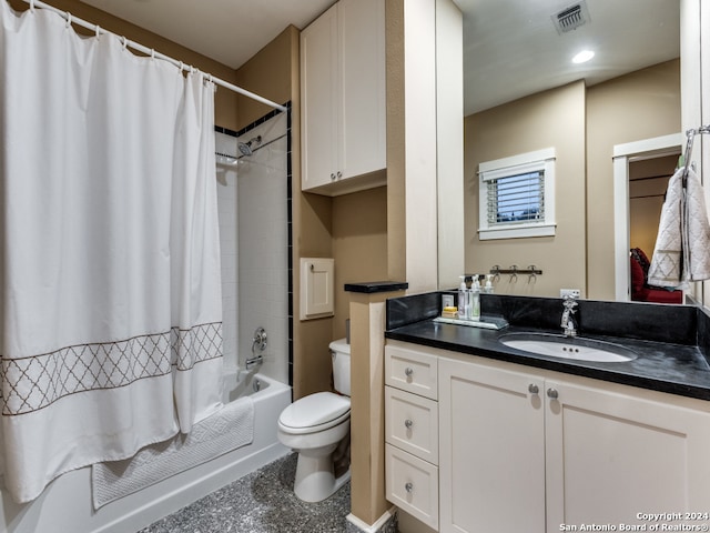 full bathroom with vanity, toilet, and shower / tub combo with curtain