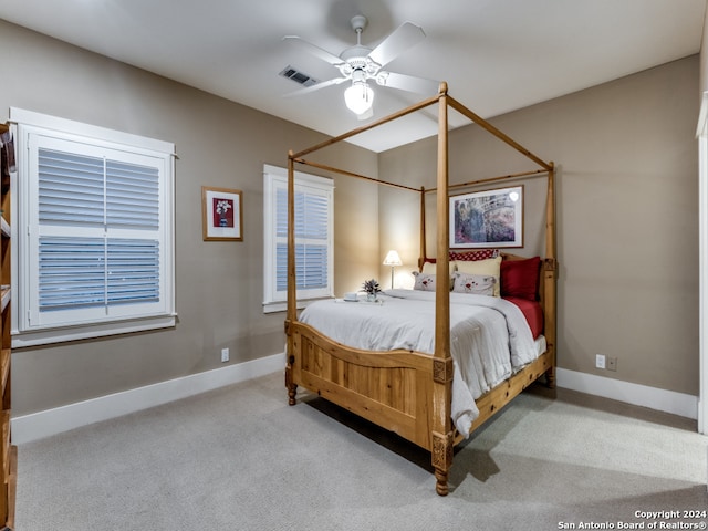 carpeted bedroom featuring ceiling fan