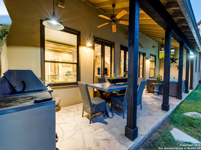 view of patio / terrace with ceiling fan and grilling area