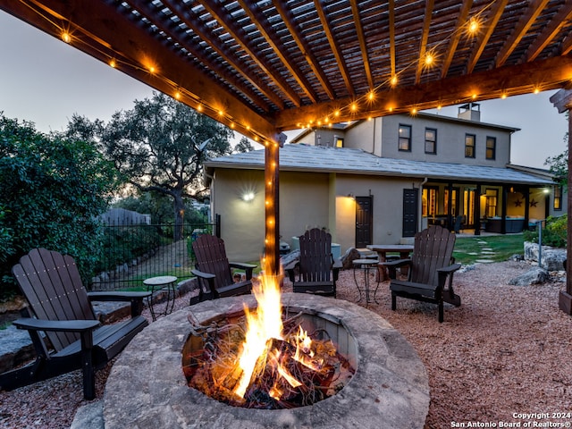 patio terrace at dusk with an outdoor fire pit