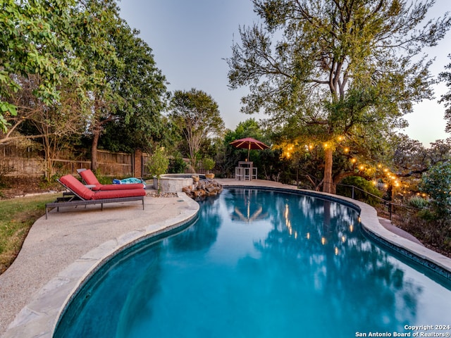 view of swimming pool featuring a patio area