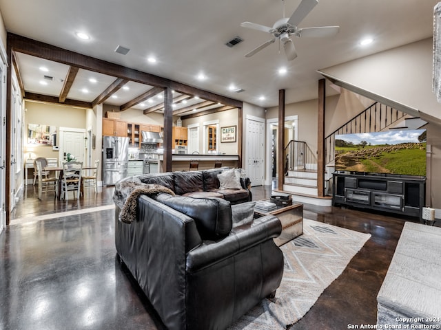 living room with beam ceiling and ceiling fan