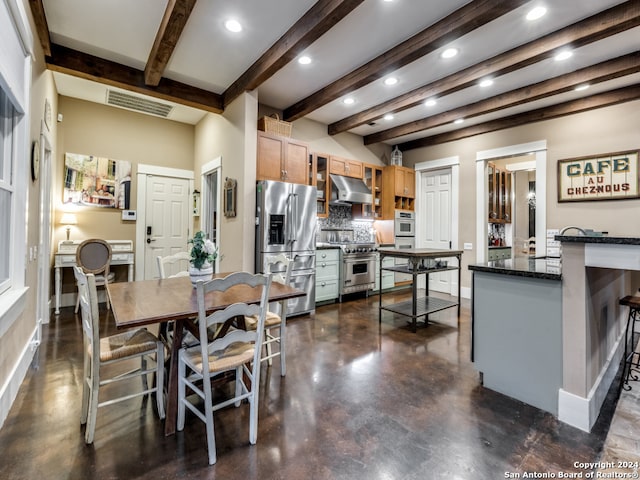 dining room with beam ceiling