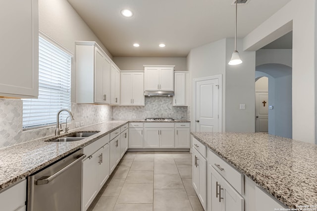 kitchen featuring appliances with stainless steel finishes, sink, and white cabinets