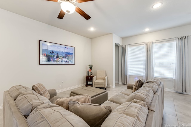 tiled living room featuring ceiling fan