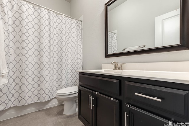 full bathroom featuring shower / tub combo, tile patterned floors, vanity, and toilet