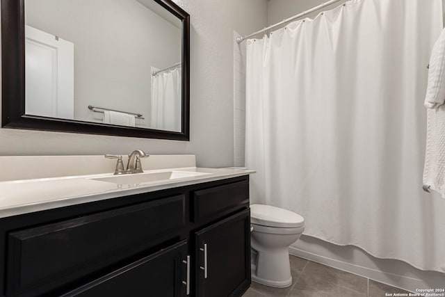 full bathroom featuring shower / bath combination with curtain, vanity, toilet, and tile patterned floors