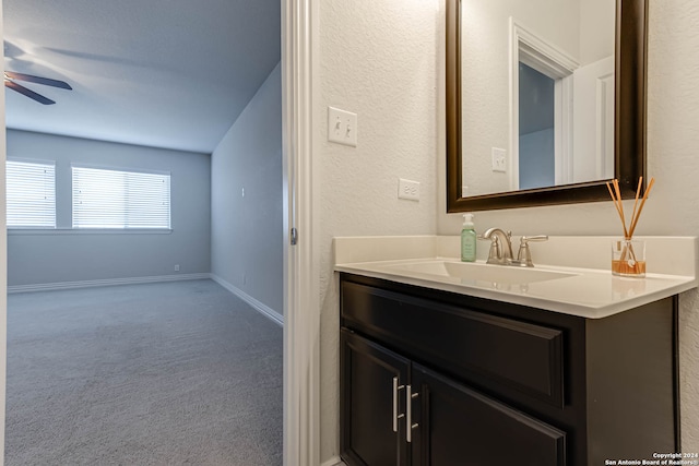 bathroom featuring ceiling fan and vanity