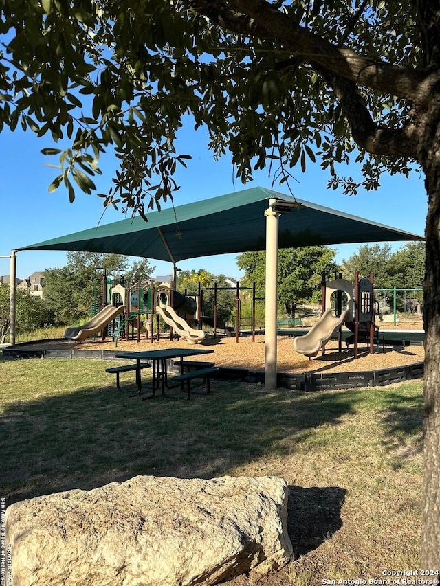 view of jungle gym with a lawn