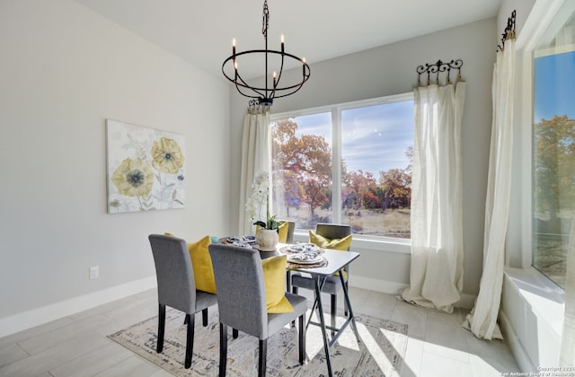 dining space featuring a notable chandelier