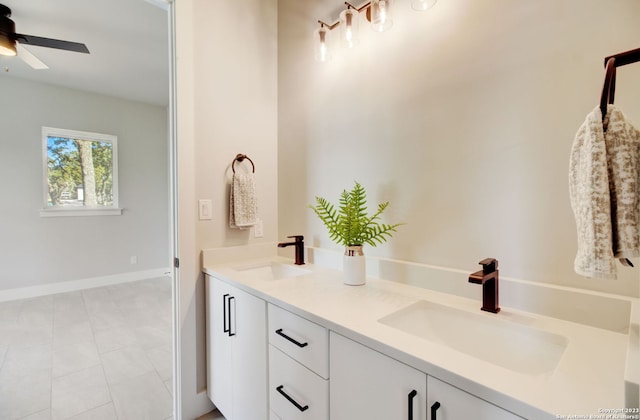 bathroom featuring ceiling fan, vanity, and tile patterned flooring