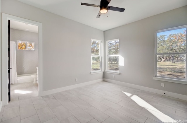 interior space with ceiling fan