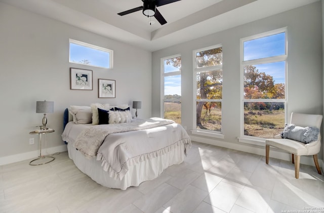 bedroom with light tile patterned floors and ceiling fan