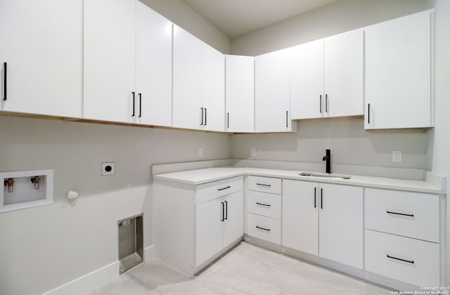 washroom featuring cabinets, washer hookup, sink, electric dryer hookup, and gas dryer hookup