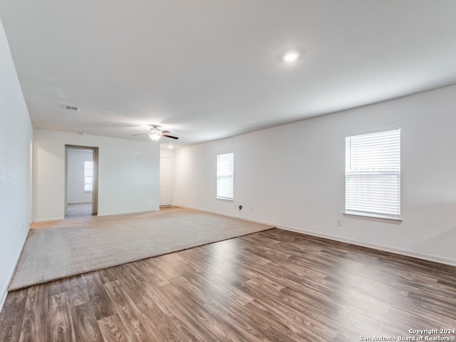 unfurnished room with wood-type flooring and ceiling fan