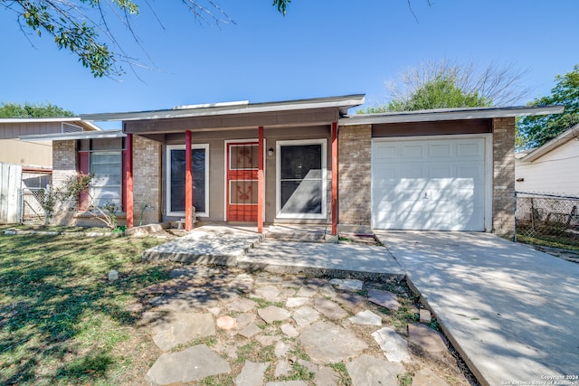 ranch-style home featuring a garage