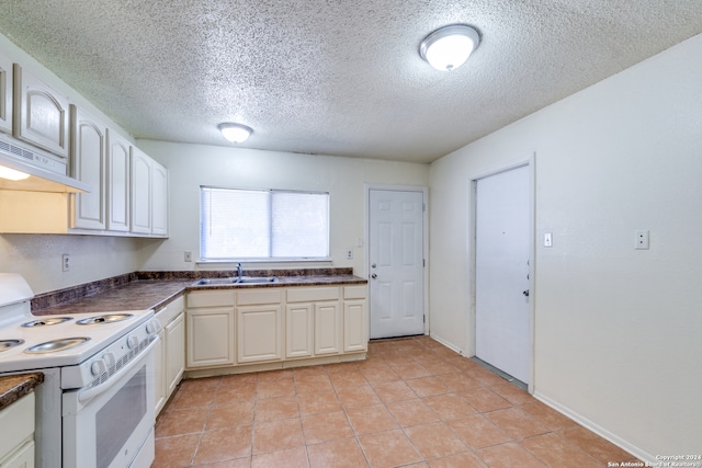 kitchen featuring white electric range oven, light tile patterned floors, sink, a textured ceiling, and extractor fan