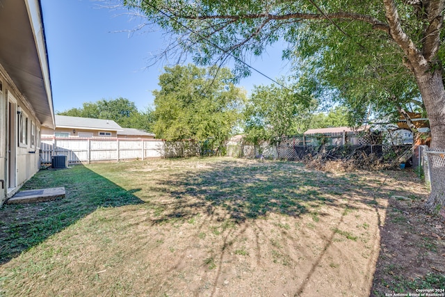 view of yard with central AC