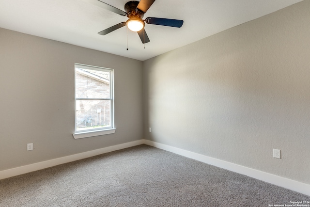 carpeted empty room with ceiling fan