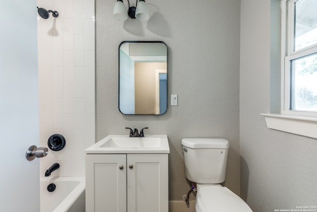 full bathroom featuring bathtub / shower combination, vanity, and toilet