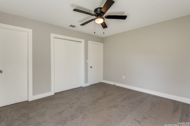 unfurnished bedroom with ceiling fan and carpet flooring