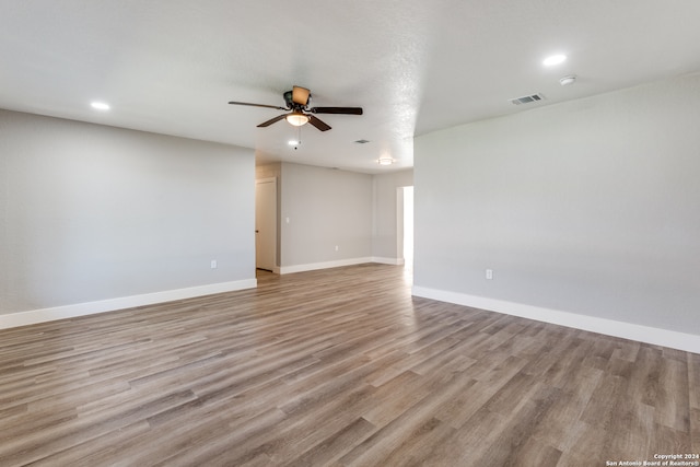 unfurnished room featuring ceiling fan and light hardwood / wood-style floors