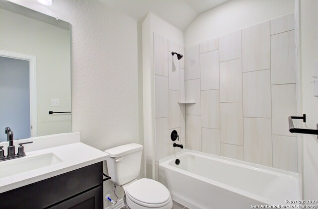 full bathroom with shower / bathing tub combination, vanity, toilet, and lofted ceiling