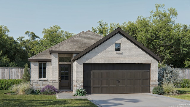 view of front of home featuring a front lawn and a garage