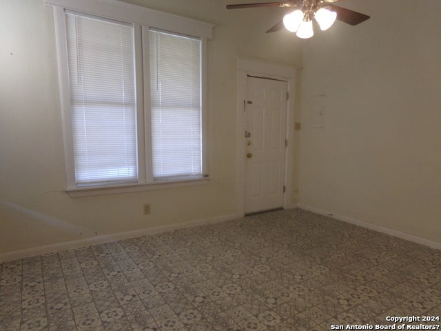 unfurnished room featuring ceiling fan