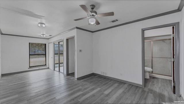 unfurnished room featuring wood-type flooring, ornamental molding, and ceiling fan