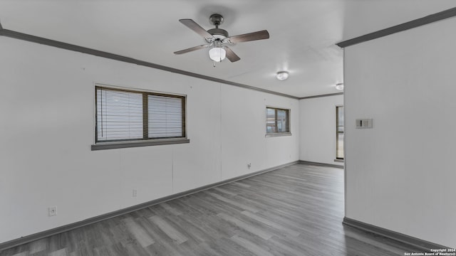 unfurnished room featuring ornamental molding, hardwood / wood-style flooring, and ceiling fan