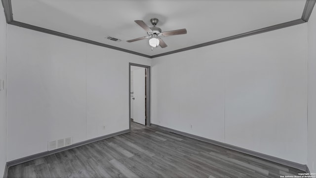 spare room with ceiling fan, crown molding, and hardwood / wood-style floors