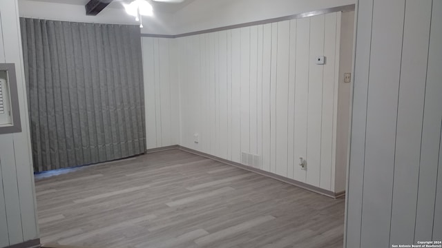 spare room featuring light hardwood / wood-style flooring and ceiling fan