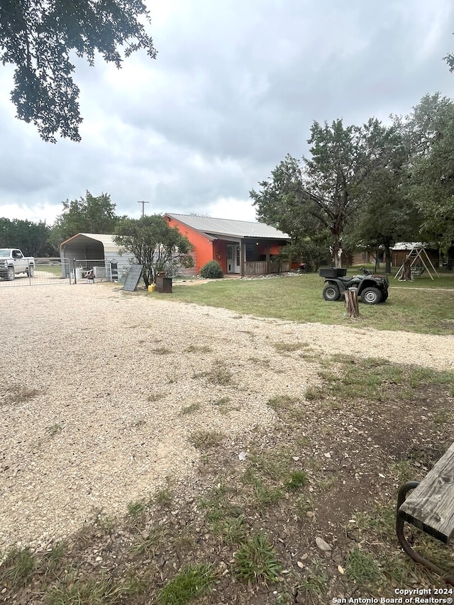 view of yard featuring a carport