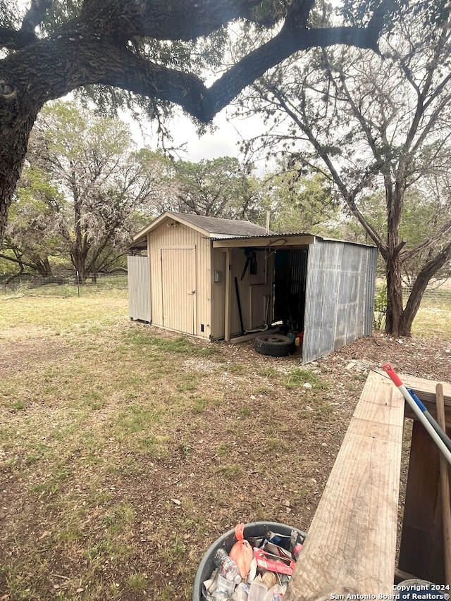 view of outdoor structure with a lawn