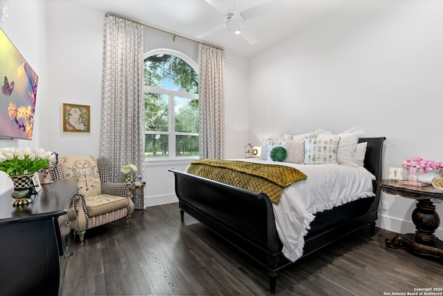 bedroom with ceiling fan and dark hardwood / wood-style flooring