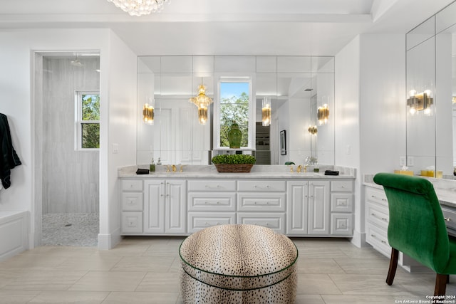 bathroom with tile patterned floors, walk in shower, and vanity