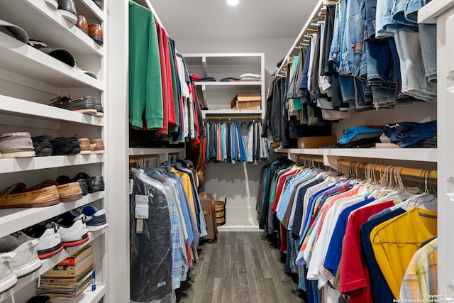 spacious closet with dark hardwood / wood-style floors