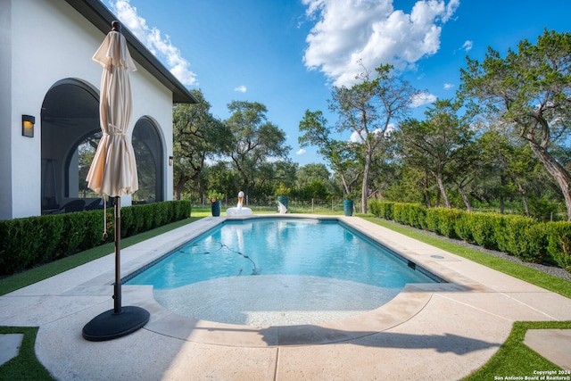 view of swimming pool featuring a patio