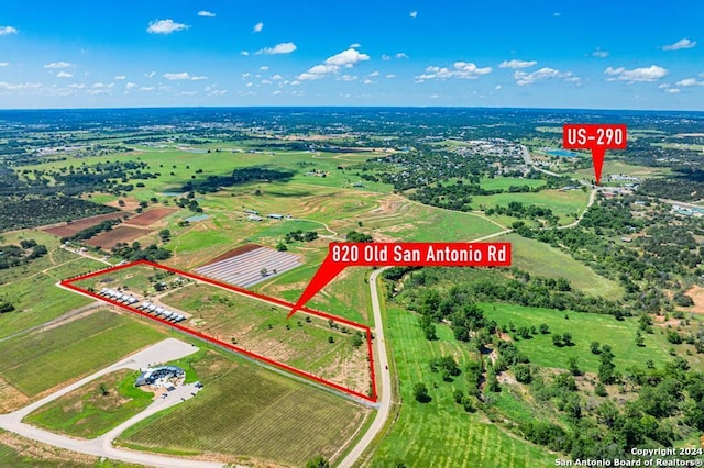 birds eye view of property featuring a rural view