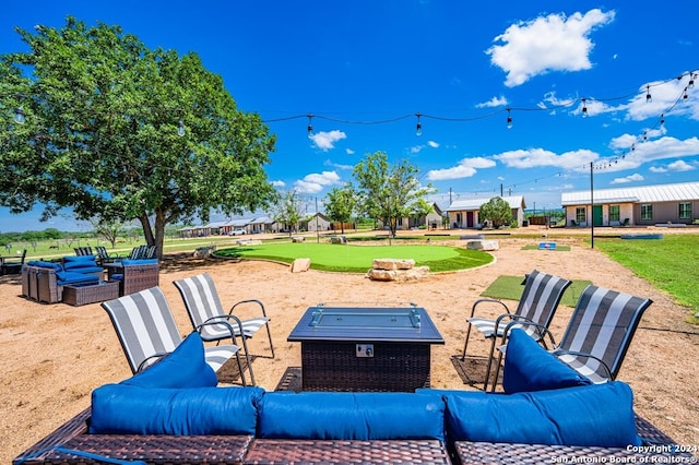 view of patio / terrace with a fire pit