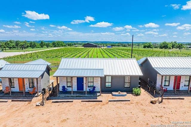 view of front of house with a rural view