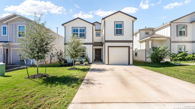 view of front of property featuring a garage and a front lawn